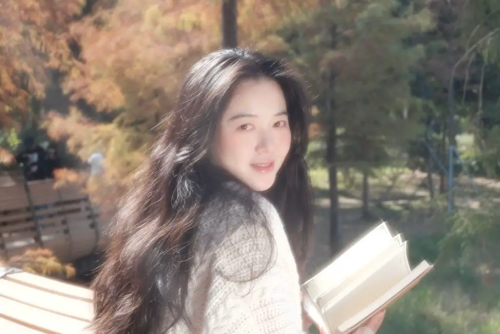 girl holding a book 2