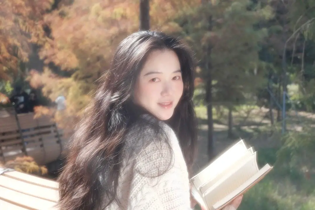 girl holding a book 2